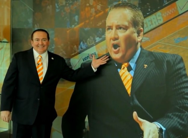 Donnie Tyndall gestures toward a large picture of Donnie Tyndall.
