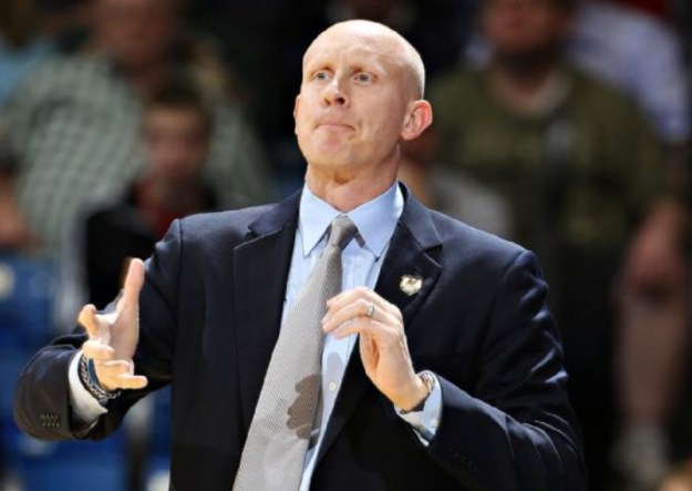 He's trying to *will* that three in the basket.